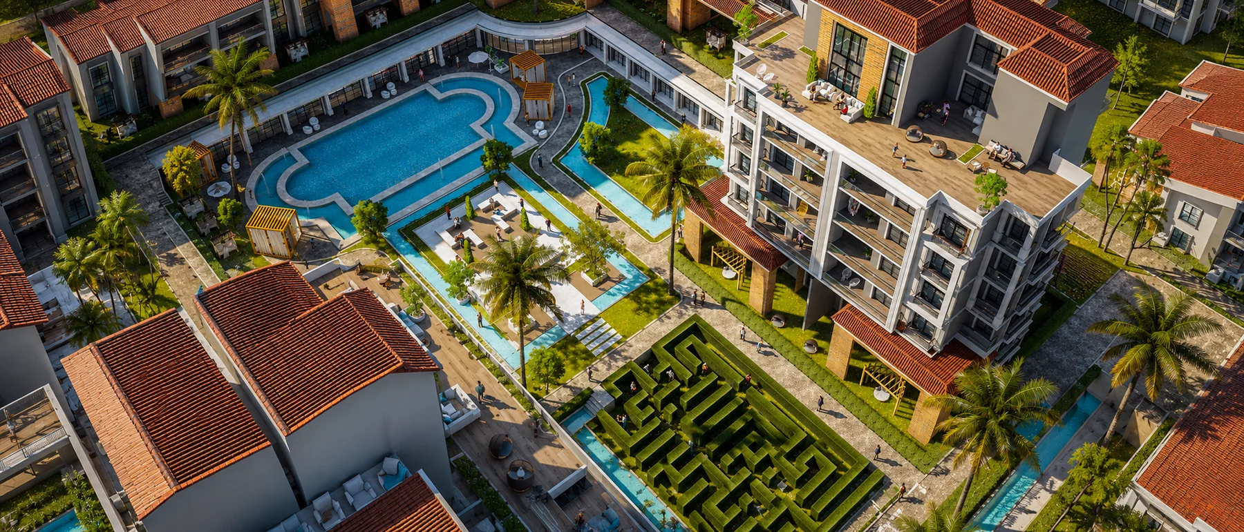 Aerial view of landscaped pools, maze garden and residences at Peerage Residence